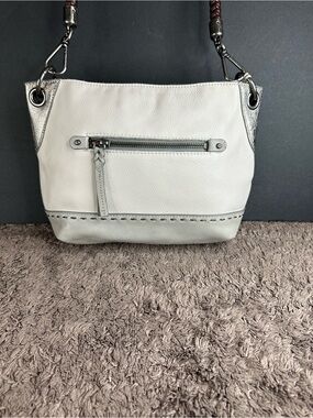 The SAK Cream Leather Shoulder Bag with Silver Accents and Braided Strap